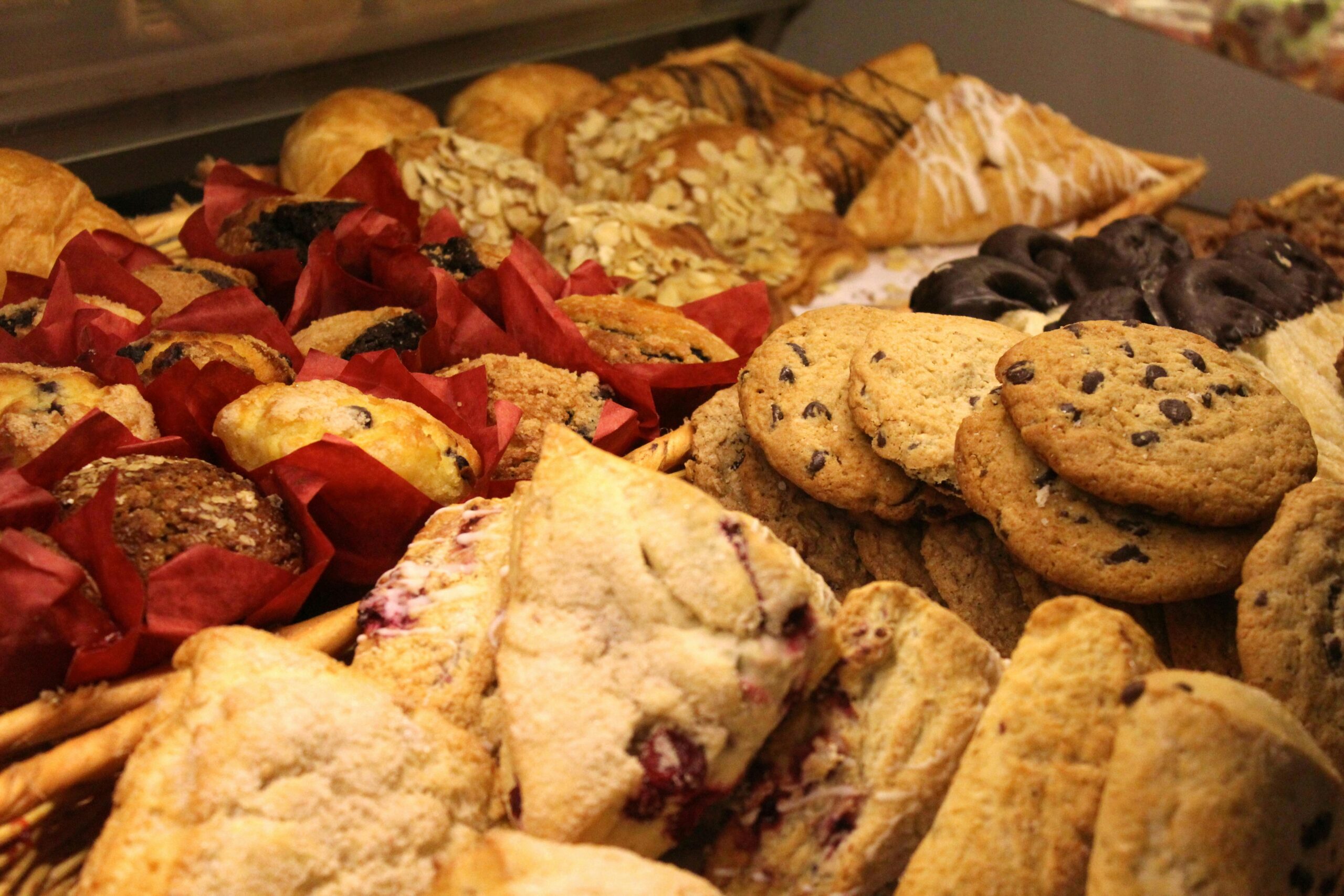 Home A delicious assortment of baked goods including cookies, muffins, and pastries ideal for breakfast or snack.